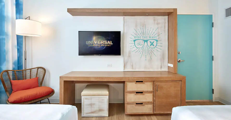 Standard room desk and entertainment at the Universal Endless Summer Resort Surfside Inn and Suites 960