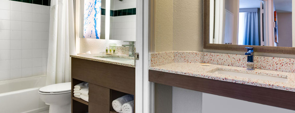 Suite Bathroom showing separate sections to allow multiple guest to get ready at the Holiday Inn Resort Orlando Suites Water Park