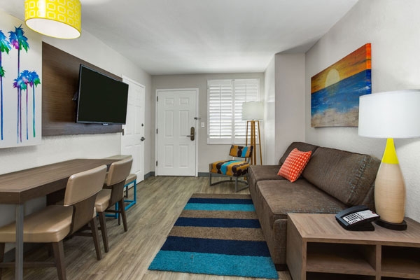 2 Bedroom Suite Living Space with Queen Sleeper Sofa at the Holiday Inn Orlando Resort Suites Waterpark