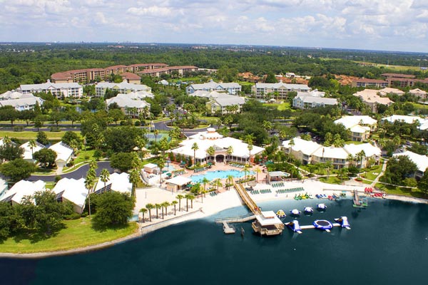 Overview of the Summer Bay Resort in Orlando Clermont Florida with Lake and Water Craft as well as a large outdoor heated pool 600