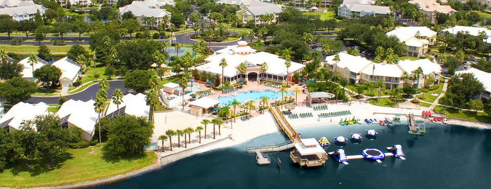 Overview of the Summer Bay Resort in Orlando Clermont Florida with Lake and Water Craft as well as a large outdoor heated pool 960