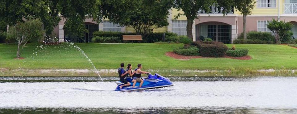 A Jet Ski with family floating on the Lake at the Summer Bay Resort in Orlando Fl