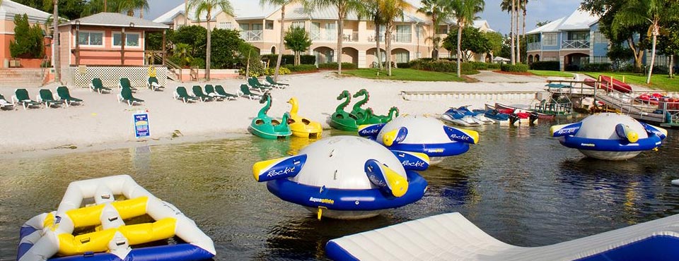 Summer Bay Resort in Orlando Lake with trampolines and slides and water craft