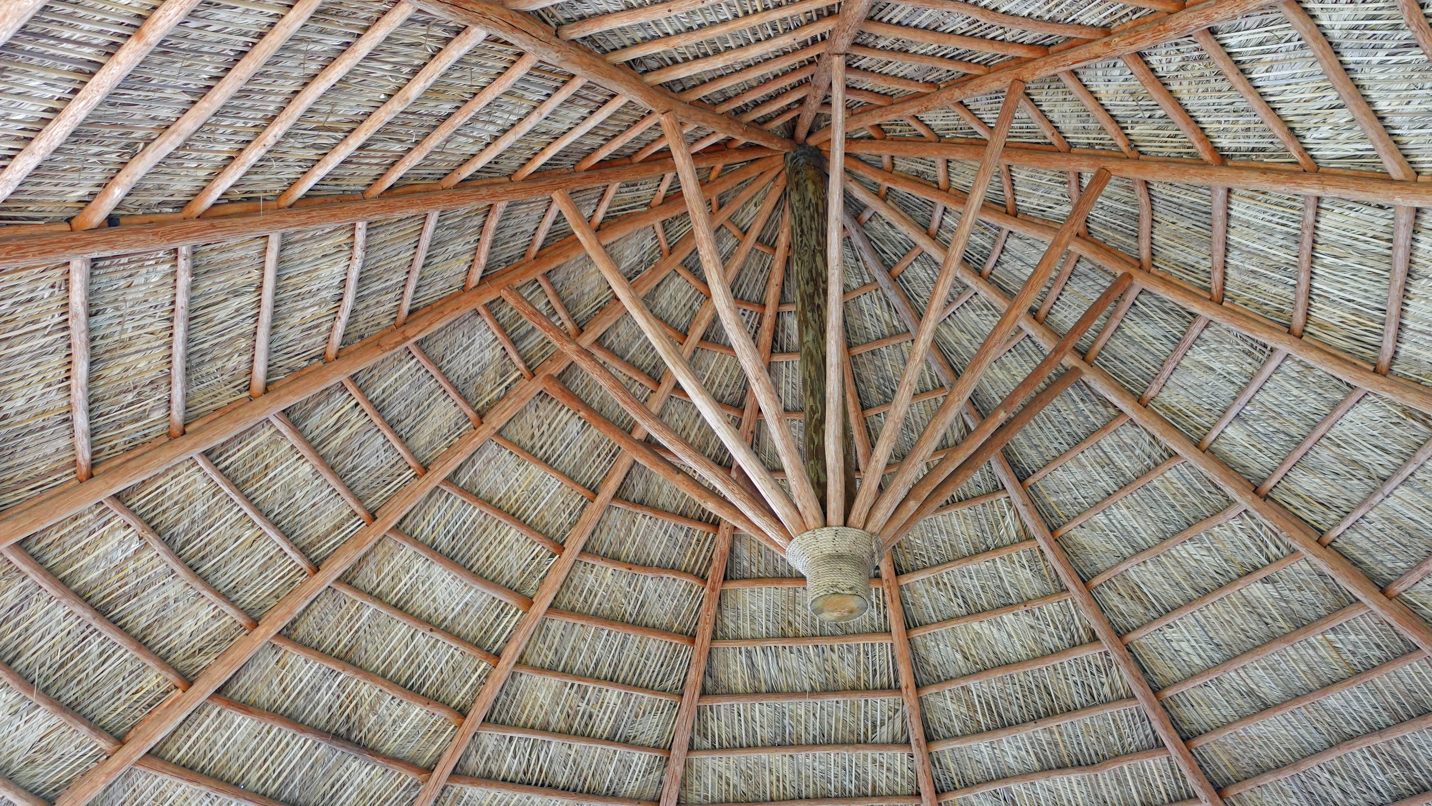the shady underside of the thatched roof on the main level of the first level of the water park of westgate town center's shipwreck island water park