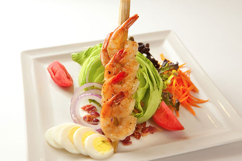 A beautifully prepared salad with skewer of shrimp from the Tropicale Caribe Royale Orlando Fl