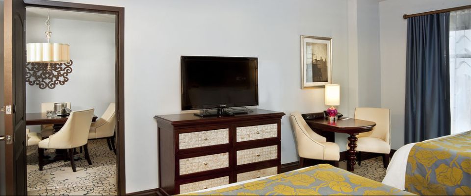 View from the bedroom with 2 queen beds looking in to the living space of the Parlor Suites at the Wyndham Grand Orlando