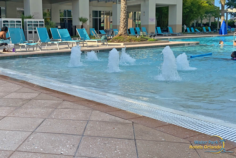 Zero entry with bubbling fountains at the Outdoor pool TownPlace Suites in Flamingo Crossing 1000